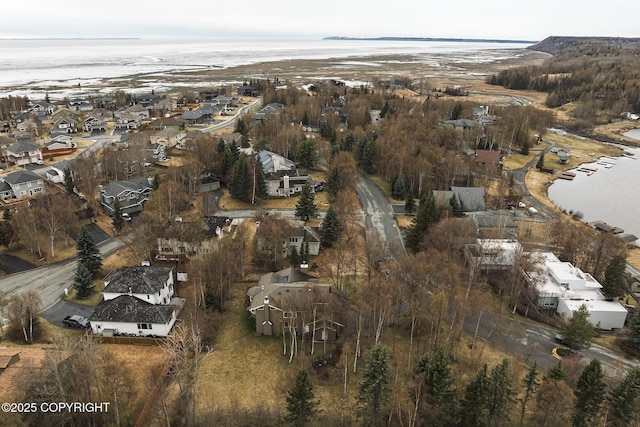 birds eye view of property featuring a water view and a residential view