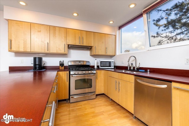 5201 E Northern Lights Blvd # 3N, Anchorage, AK 99508 - kitchen with recessed lighting, dark countertops, appliances with stainless steel finishes, and a sink