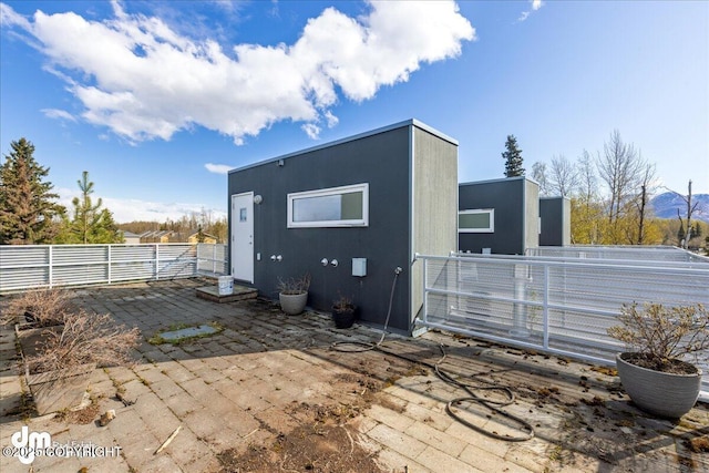 5201 E Northern Lights Blvd # 3N, Anchorage, AK 99508 - back of house with a patio area and fence