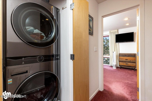 5201 E Northern Lights Blvd # 3N, Anchorage, AK 99508 - clothes washing area with stacked washer and clothes dryer, carpet, and laundry area