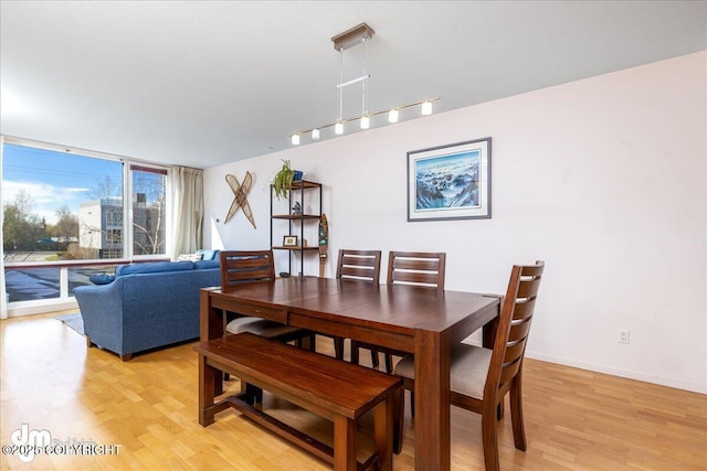 5201 E Northern Lights Blvd # 3N, Anchorage, AK 99508 - dining room featuring light wood-style floors