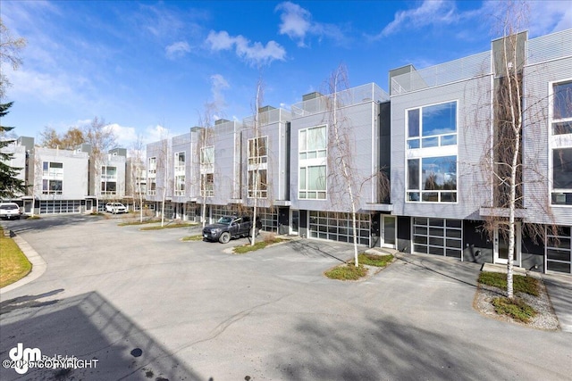 5201 E Northern Lights Blvd # 3N, Anchorage, AK 99508 - view of property with an attached garage