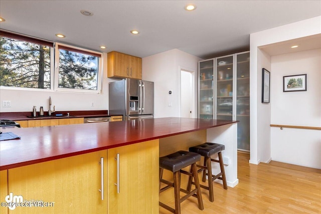 5201 E Northern Lights Blvd # 3N, Anchorage, AK 99508 - kitchen with recessed lighting, dark countertops, appliances with stainless steel finishes, and a sink