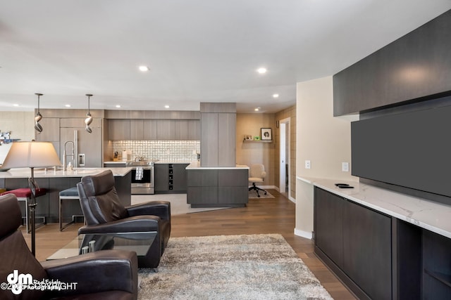1741 W 15th Ave, Anchorage, AK 99501 - living room with recessed lighting, baseboards, and wood finished floors
