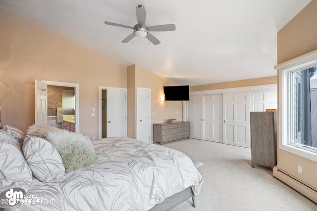 1741 W 15th Ave, Anchorage, AK 99501 - bedroom with multiple windows, a baseboard heating unit, vaulted ceiling, and light carpet