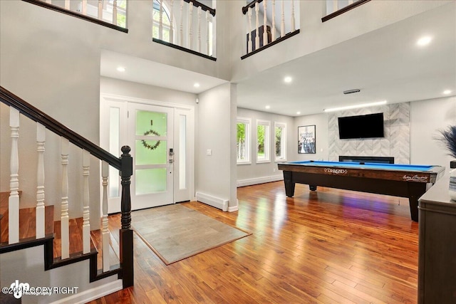 4200 Endeavor Cir, Anchorage, AK 99515 - entryway featuring billiards, wood finished floors, baseboards, a high ceiling, and recessed lighting