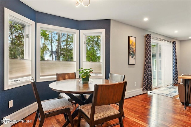 4200 Endeavor Cir, Anchorage, AK 99515 - dining room featuring wood finished floors, baseboards, and recessed lighting