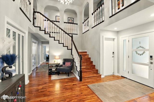 4200 Endeavor Cir, Anchorage, AK 99515 - entryway featuring a high ceiling, stairs, wood finished floors, and baseboards