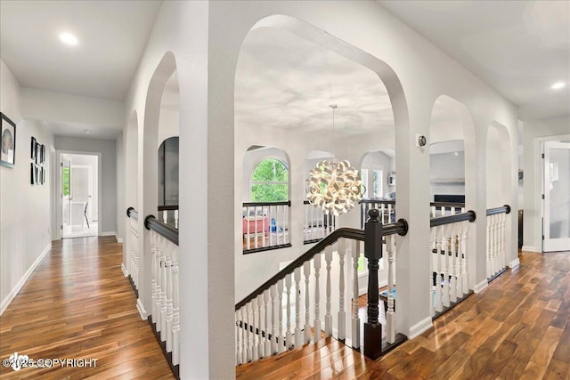 4200 Endeavor Cir, Anchorage, AK 99515 - hallway with wood finished floors, an upstairs landing, baseboards, and recessed lighting