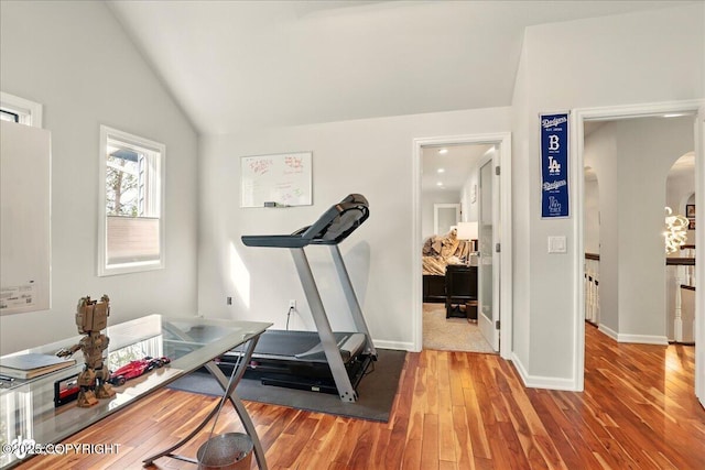 4200 Endeavor Cir, Anchorage, AK 99515 - workout room with arched walkways, lofted ceiling, wood finished floors, and baseboards