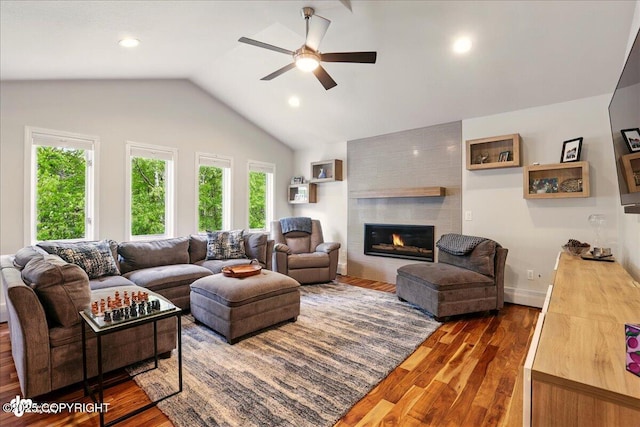 4200 Endeavor Cir, Anchorage, AK 99515 - living area featuring ceiling fan, wood finished floors, a tiled fireplace, lofted ceiling, and recessed lighting