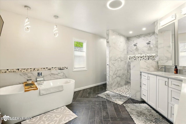 4200 Endeavor Cir, Anchorage, AK 99515 - full bath with a walk in shower, a freestanding bath, tile walls, vanity, and baseboards