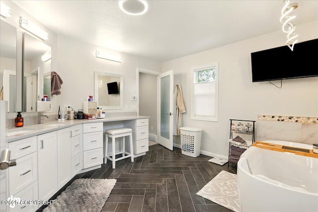 4200 Endeavor Cir, Anchorage, AK 99515 - full bathroom featuring vanity, a bath, and baseboards