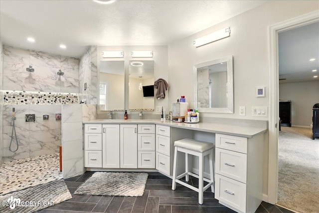 4200 Endeavor Cir, Anchorage, AK 99515 - bathroom featuring a marble finish shower, vanity, and recessed lighting