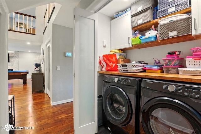 4200 Endeavor Cir, Anchorage, AK 99515 - laundry area featuring washer and dryer, cabinet space, wood finished floors, and billiards table