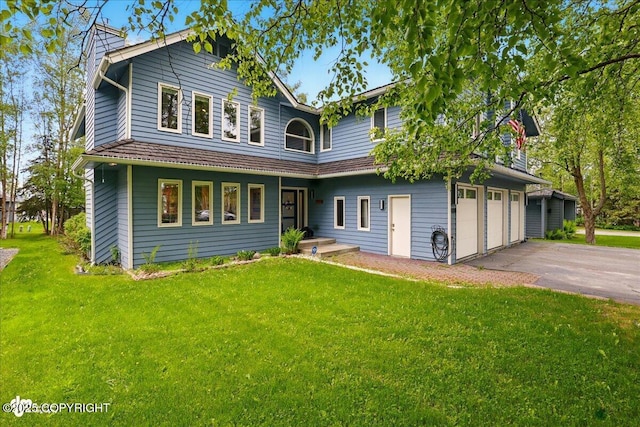 4200 Endeavor Cir, Anchorage, AK 99515 - traditional-style house featuring asphalt driveway, a front lawn, and an attached garage