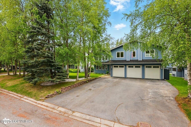 4200 Endeavor Cir, Anchorage, AK 99515 - view of front of property with a garage, driveway, and a front lawn