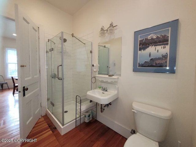 1 Fort Seward Dr, Haines, AK 99827 - full bath with wood finished floors, toilet, a stall shower, and a sink