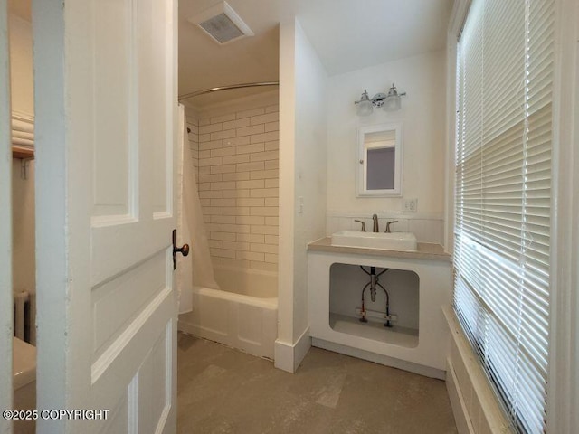 1 Fort Seward Dr, Haines, AK 99827 - full bath featuring a sink, visible vents, and shower / bathtub combination with curtain