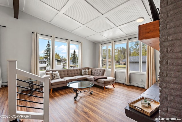 living area with wood finished floors and baseboard heating