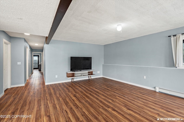 unfurnished living room featuring a textured ceiling, wood finished floors, baseboards, and a baseboard heating unit