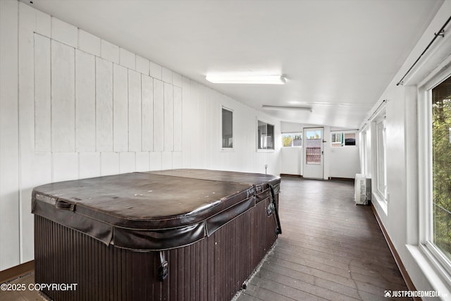 kitchen featuring healthy amount of natural light, dark wood finished floors, dark brown cabinetry, and vaulted ceiling