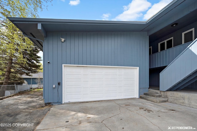 garage with concrete driveway