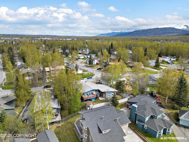 aerial view of residential area featuring mountains