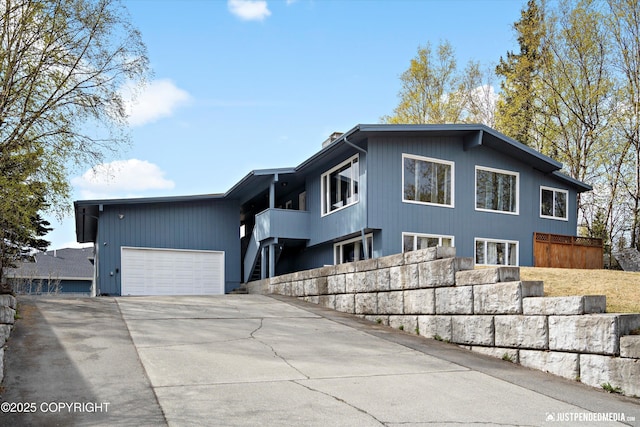 view of front of property featuring a garage and driveway