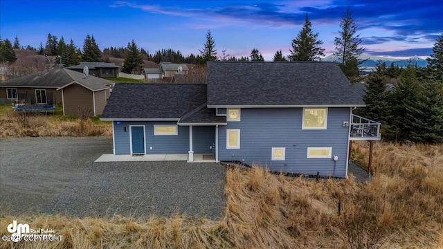 885 Soundview Ave, Homer, AK 99603 - view of front of property with a trampoline and roof with shingles