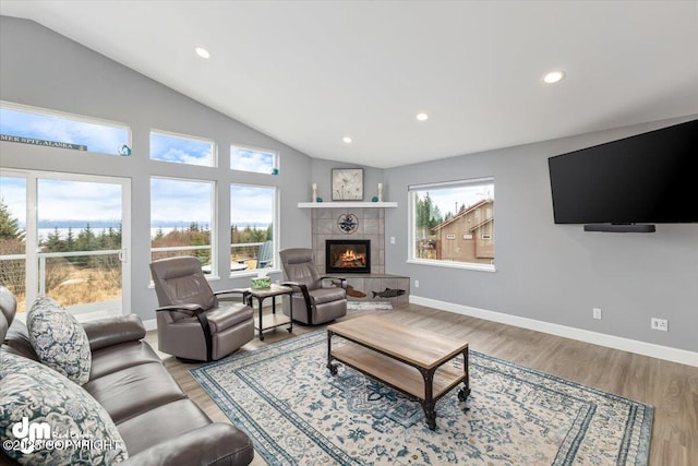885 Soundview Ave, Homer, AK 99603 - living area with recessed lighting, a tile fireplace, lofted ceiling, and baseboards