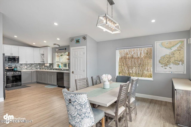 885 Soundview Ave, Homer, AK 99603 - dining space featuring lofted ceiling, recessed lighting, light wood-style flooring, and baseboards
