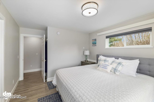 885 Soundview Ave, Homer, AK 99603 - bedroom with baseboards and wood finished floors