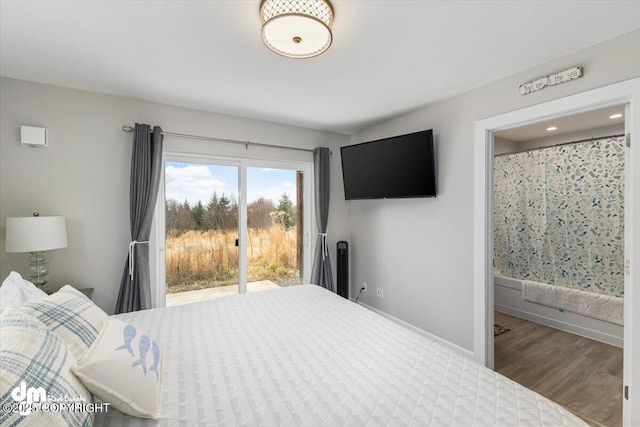 885 Soundview Ave, Homer, AK 99603 - bedroom featuring wood finished floors, access to exterior, and baseboards