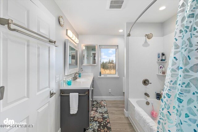 885 Soundview Ave, Homer, AK 99603 - full bath featuring vanity, shower / bath combination with curtain, visible vents, baseboards, and wood finished floors
