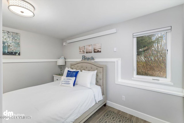 885 Soundview Ave, Homer, AK 99603 - bedroom with wood finished floors and baseboards