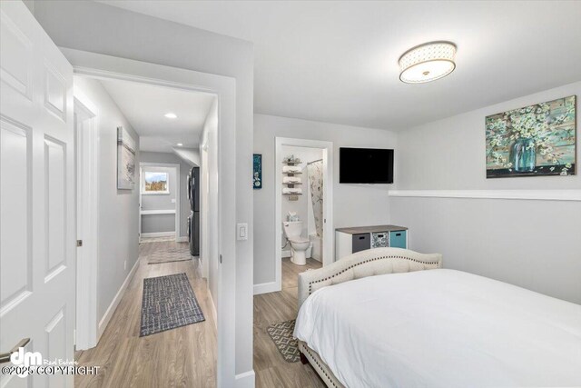 885 Soundview Ave, Homer, AK 99603 - bedroom featuring ensuite bathroom, recessed lighting, light wood finished floors, and baseboards
