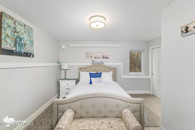 885 Soundview Ave, Homer, AK 99603 - bedroom featuring baseboards and wood finished floors
