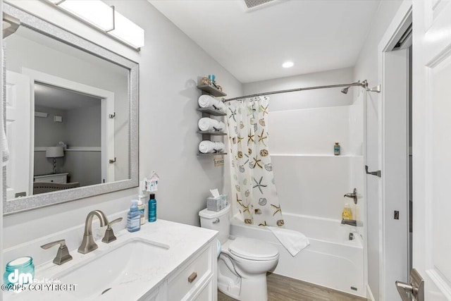 885 Soundview Ave, Homer, AK 99603 - full bathroom with wood finished floors, shower / tub combo with curtain, toilet, and vanity