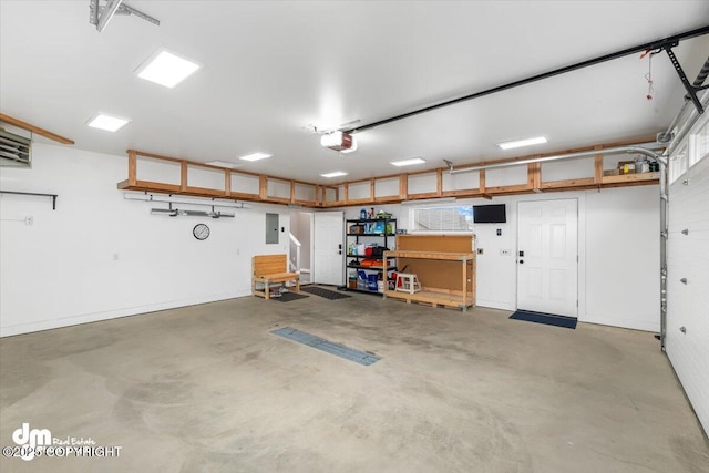 885 Soundview Ave, Homer, AK 99603 - garage with electric panel and a garage door opener