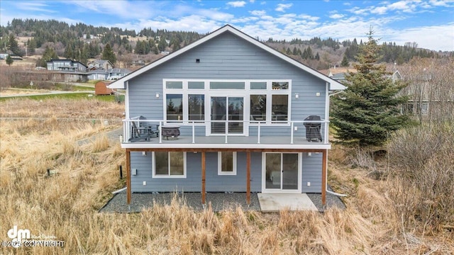 885 Soundview Ave, Homer, AK 99603 - back of property with a patio area and a balcony