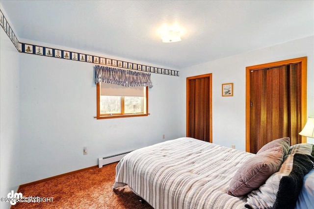 carpeted bedroom featuring a baseboard radiator and baseboards