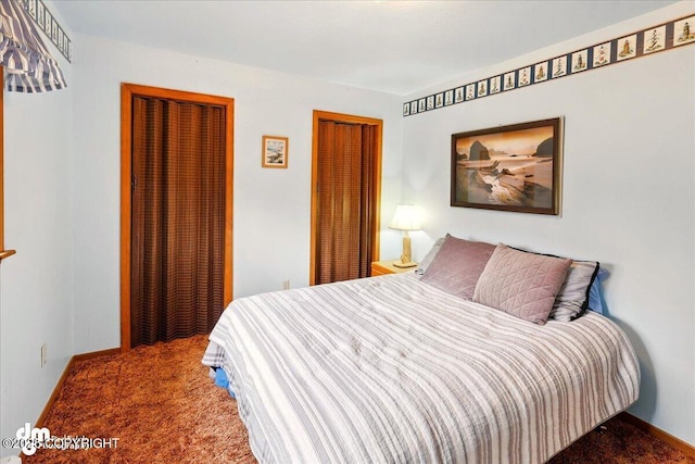 bedroom with carpet floors and baseboards