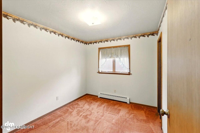 unfurnished room featuring baseboard heating, light colored carpet, and baseboards