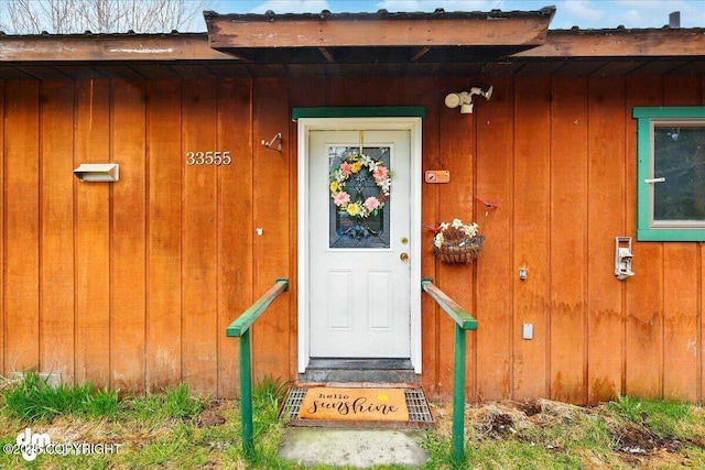entrance to property featuring board and batten siding
