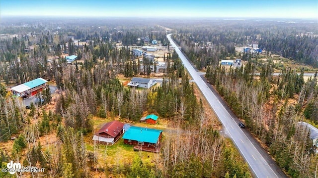 aerial overview of property's location featuring a forest