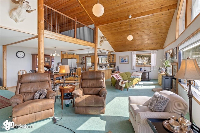 3669 Pullen Cir, Eagle River, AK 99577 - living area with carpet, high vaulted ceiling, wooden ceiling, a chandelier, and a wood stove