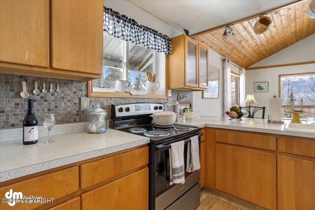 3669 Pullen Cir, Eagle River, AK 99577 - kitchen featuring stainless steel electric range, light countertops, decorative backsplash, and lofted ceiling