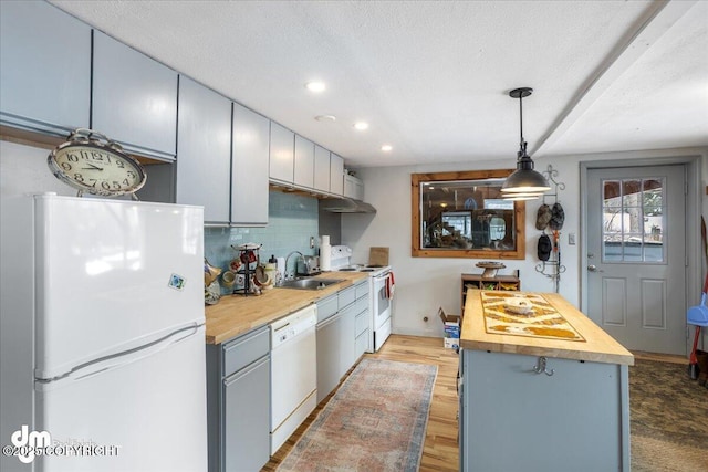 3669 Pullen Cir, Eagle River, AK 99577 - kitchen featuring white appliances, butcher block countertops, a sink, recessed lighting, and light wood-type flooring