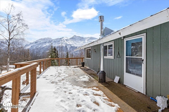 3669 Pullen Cir, Eagle River, AK 99577 - snow covered patio featuring a deck with mountain view